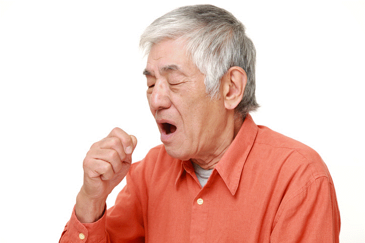 A photo of a man coughing.