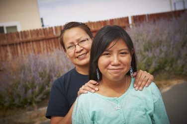 A photo of a Native American woman and her daughter.