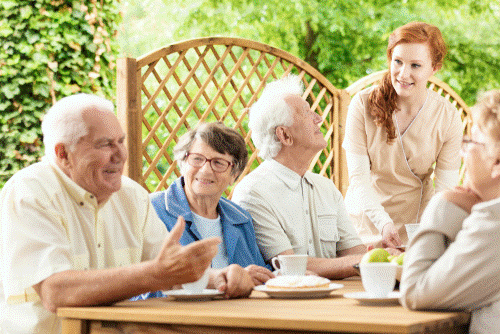 A group of older adults enjoying a meal.