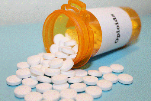 Opioid Pills Pill bottle full of opioids.
