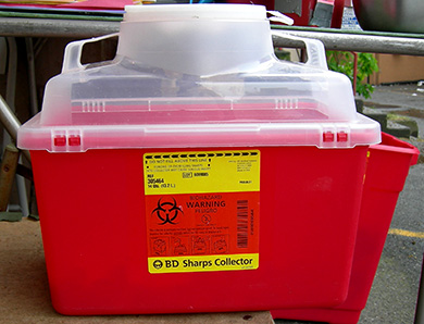 Sharps Container A photo of a sharps container.