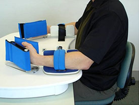 A photograph of a device used for upper  extremity training called the Rocker.