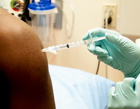 Person getting a vaccine.