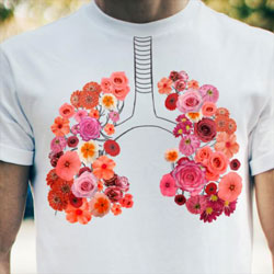 T-Shirt showing the lungs as colorful flowers.