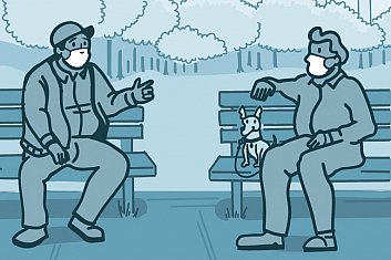 Two men with masks talking on park bench.