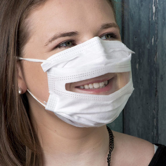 A photo of a woman wearing a Safe'N'Clear mask.