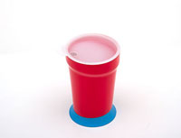 A cup with a weighted bottom and a lid.