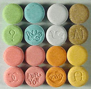 A photograph of colorful ecstasy tablets.