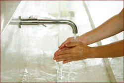 A photo of a person washing their hands.