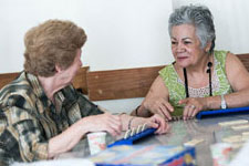 Two women engaged in an individual activity.