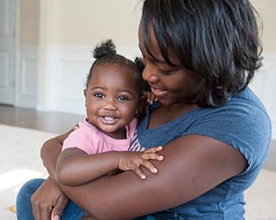 A photo of a mother with her toddler.