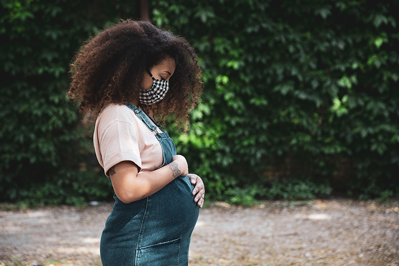 A photo of a young pregnant woman.