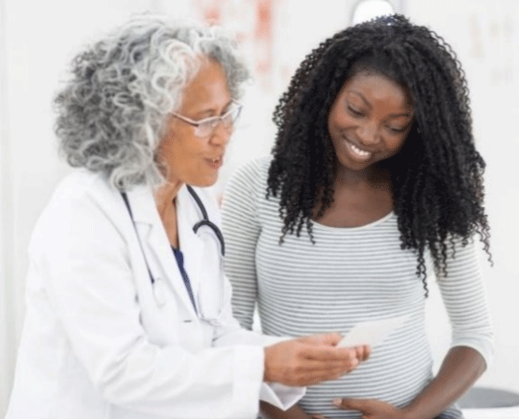 A doctor talking to a patient.