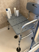 photo of shower chair with back and rails