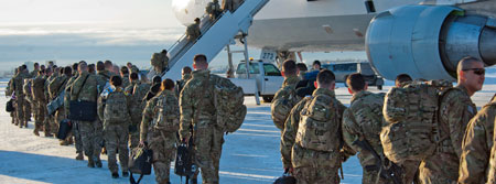 photo of troops boarding a plane