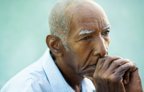 Photo: man depressed about the loss of his spouse