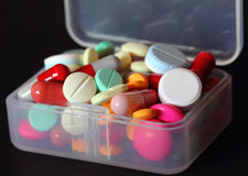 image of overflowing, disorganized pillbox image of overflowing, disorganized pillbox