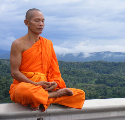 A man meditating.