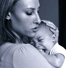 Mother with Infant A mother comforting her infant.