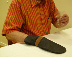 A photograph of a mitten used to constrain movement on the unaffected hand.
