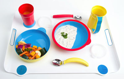 A complete dinner set with assistive tableware.